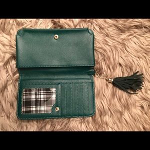 Francesca’s green wallet/phone case.